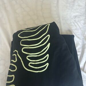 Black Halloween Men’s onesie, with White Skeleton Design